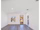 Bright and airy living room with wood-look floors and neutral walls at 14949 Sw 65Th Avenue Rd, Ocala, FL 34473