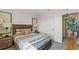 Comfortable bedroom with wood bed frame, window, and access to bathroom at 1528 Ellesmere Ave, Haines City, FL 33844