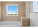 Bathroom with bathtub and window offering water views at 225 W Seminole Blvd # 512, Sanford, FL 32771
