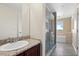 Bathroom with granite vanity, walk-in shower, and bathtub at 225 W Seminole Blvd # 512, Sanford, FL 32771