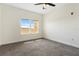 Bright bedroom with large window, carpet, and ceiling fan at 225 W Seminole Blvd # 512, Sanford, FL 32771