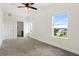Bright bedroom with large windows, carpet, and ensuite bathroom at 225 W Seminole Blvd # 512, Sanford, FL 32771