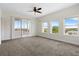 Main bedroom with carpet and access to a private balcony at 225 W Seminole Blvd # 512, Sanford, FL 32771