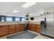Community kitchen with stainless steel appliances and granite countertops at 225 W Seminole Blvd # 512, Sanford, FL 32771