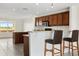 Kitchen with breakfast bar and dark wood cabinets at 225 W Seminole Blvd # 512, Sanford, FL 32771