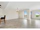 Spacious living room with tile floors and access to balcony at 225 W Seminole Blvd # 512, Sanford, FL 32771