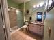Bathroom with granite vanity and walk-in shower at 2306 Silver Palm Dr # 103, Kissimmee, FL 34747