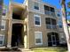 Building exterior with stairs and address visible at 2306 Silver Palm Dr # 103, Kissimmee, FL 34747