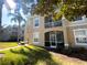 Exterior view of condo building, showing building facade and landscaping at 2306 Silver Palm Dr # 103, Kissimmee, FL 34747