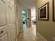 Hallway view into the kitchen and dining area at 2306 Silver Palm Dr # 103, Kissimmee, FL 34747