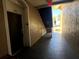 Interior hallway with dark door and stairway leading outside at 2306 Silver Palm Dr # 103, Kissimmee, FL 34747