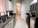 Kitchen with stainless steel appliances and granite countertops at 2306 Silver Palm Dr # 103, Kissimmee, FL 34747