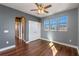Bright and airy bedroom with wood floors, ceiling fan, and closet at 2731 Flintlock Ave, Clermont, FL 34711