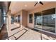 Screened and covered patio with multiple windows and sliding glass doors at 2731 Flintlock Ave, Clermont, FL 34711