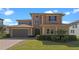 Charming two-story home with a welcoming front entrance and landscaped yard at 2731 Flintlock Ave, Clermont, FL 34711