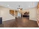 Open-concept living area with view of kitchen and staircase at 2731 Flintlock Ave, Clermont, FL 34711