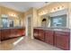 Double vanity, tile floors, and ample counter space highlight this bathroom at 2731 Flintlock Ave, Clermont, FL 34711