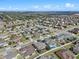 Expansive view of a residential neighborhood with houses, pools, and open areas at 2731 Flintlock Ave, Clermont, FL 34711