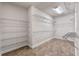 Large walk-in closet with built-in shelving at 2731 Flintlock Ave, Clermont, FL 34711