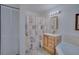 Clean bathroom with shower, tub, vanity, and linen closet at 320 Volusian Forest Trl, Pierson, FL 32180