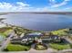 Aerial view of community clubhouse and lake at 4112 Aberdeen Ln, Lake Wales, FL 33859