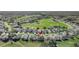 Aerial view showcasing home's location in golf course community at 5025 St Andrews Arc, Leesburg, FL 34748