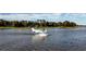 Seaplane landing on calm lake near home at 6320 Rocky Point Rd, Lake Wales, FL 33898