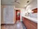 Bathroom with double vanity and patterned tile floor at 6320 Rocky Point Rd, Lake Wales, FL 33898