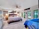 Large bedroom with king bed and access to patio at 6320 Rocky Point Rd, Lake Wales, FL 33898