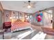 Spacious bedroom with large windows and eclectic decor at 6320 Rocky Point Rd, Lake Wales, FL 33898
