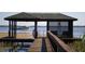 Seaplane landing near lakeside dock and gazebo at 6320 Rocky Point Rd, Lake Wales, FL 33898