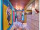 Long entryway featuring eclectic decor and wood-look floors at 6320 Rocky Point Rd, Lake Wales, FL 33898