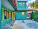 Teal home exterior with unique landscaping at 6320 Rocky Point Rd, Lake Wales, FL 33898