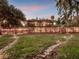 Lakefront home with screened porch and stone pathway at 6320 Rocky Point Rd, Lake Wales, FL 33898