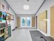 Home gym with exercise equipment and doors leading to the outdoors at 6320 Rocky Point Rd, Lake Wales, FL 33898