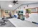 Home gym with exercise equipment, a TV, and motivational wall decor at 6320 Rocky Point Rd, Lake Wales, FL 33898