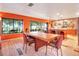 Open kitchen with modern cabinetry, island, and a view to the backyard at 6320 Rocky Point Rd, Lake Wales, FL 33898