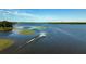 Seaplane taking off from a lake with trees in the background at 6320 Rocky Point Rd, Lake Wales, FL 33898