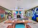 Spacious living area with a wood-slab coffee table and fireplace at 6320 Rocky Point Rd, Lake Wales, FL 33898