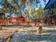 Stone patio with seating area and view of goats at 6320 Rocky Point Rd, Lake Wales, FL 33898