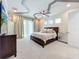 Bright bedroom with a king bed and private access to balcony at 6326 Swanson St, Windermere, FL 34786