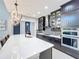 Modern kitchen with white quartz countertops and dark wood cabinets at 6326 Swanson St, Windermere, FL 34786