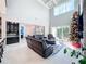 Spacious living room with high ceilings, fireplace and ample natural light at 6326 Swanson St, Windermere, FL 34786