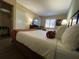 Hotel bedroom with double beds, TV, and closet at 7601 Canada Ave # 221, Orlando, FL 32819