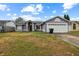 Cute one-story home with attached garage and well-maintained lawn at 8236 Scarborough Ct, Orlando, FL 32829