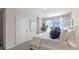 Bright bedroom with a king bed and large window at 1218 Balsam Dr, Davenport, FL 33837