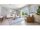 Living area features a comfy lounge chair and patio access at 1226 Balsam Dr, Davenport, FL 33837