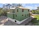 Two-story house under construction, with green building wrap and visible framing at 1309 Errol Green Ct, Apopka, FL 32712