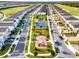 Aerial view of neighborhood with playground and basketball court at 1429 Moon Valley Dr, Champions Gate, FL 33896