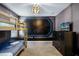Space-themed bedroom with a bunk bed and a lighted wall feature at 1429 Moon Valley Dr, Champions Gate, FL 33896